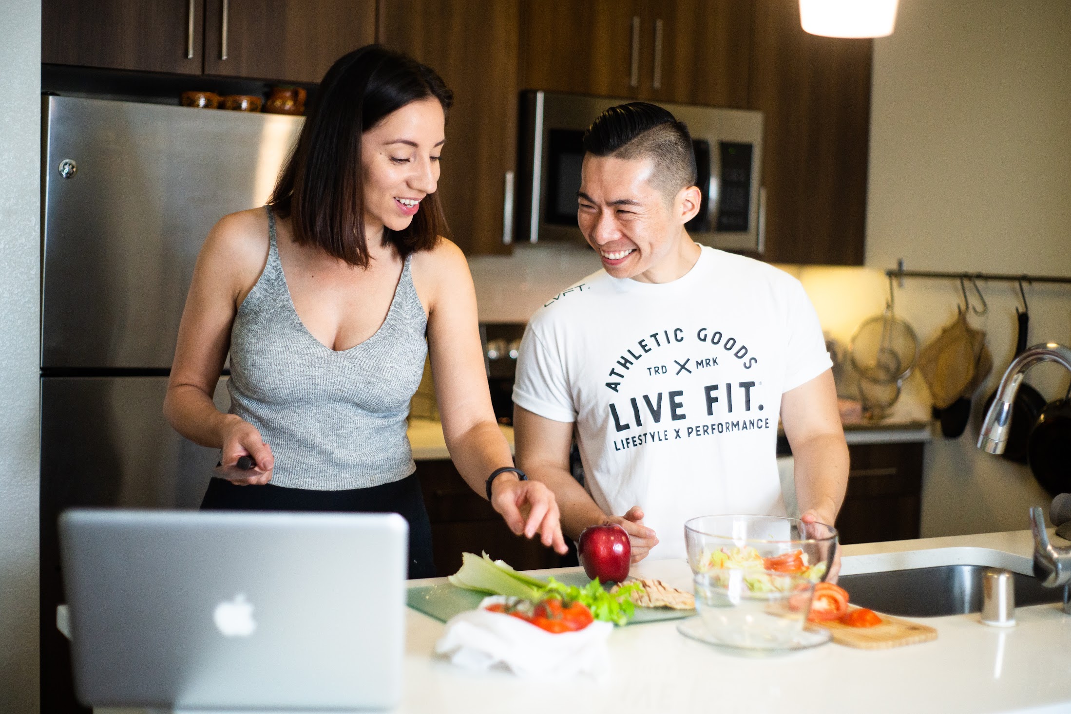 Image of two people preparing a meal