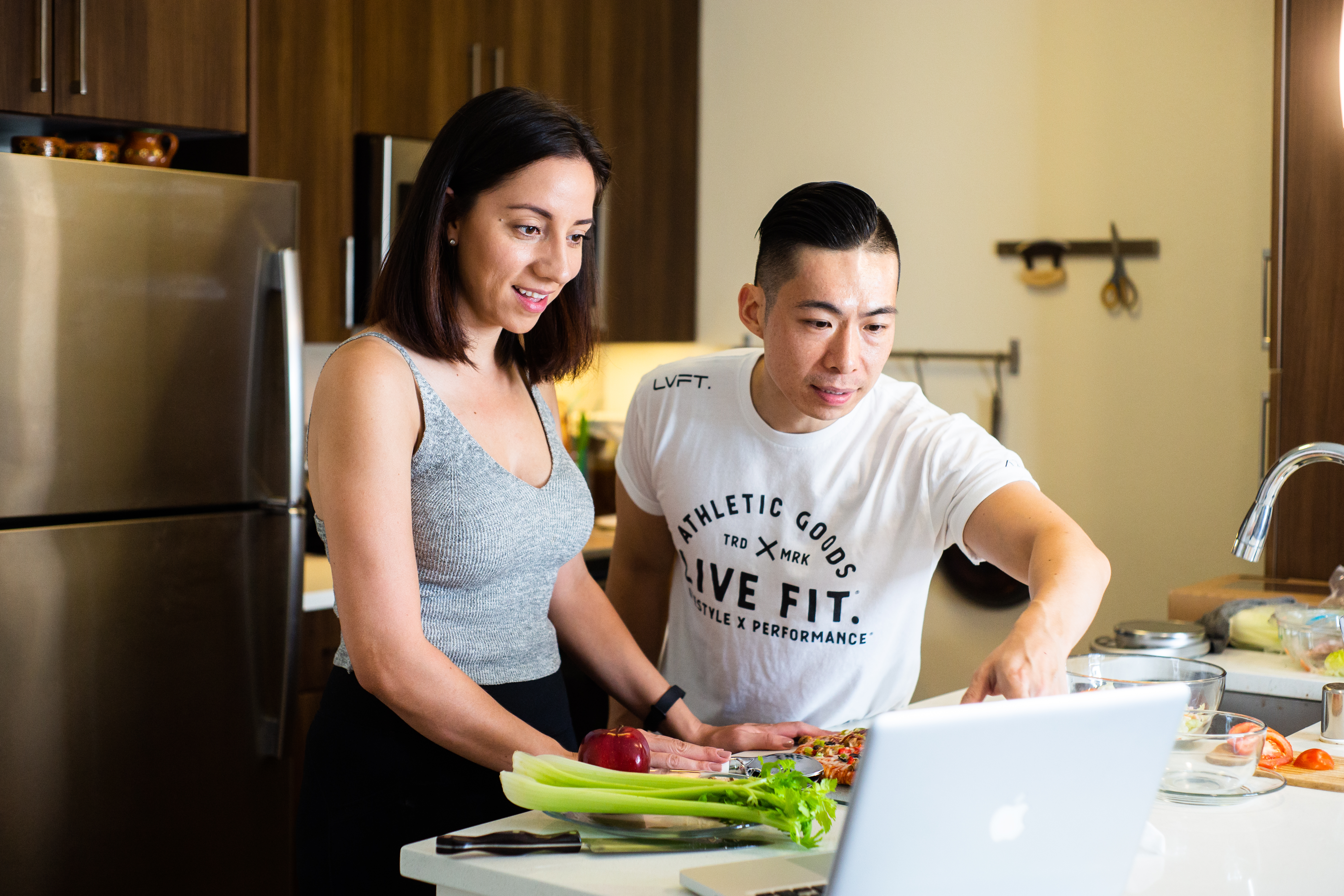 Image of two people preparing a meal