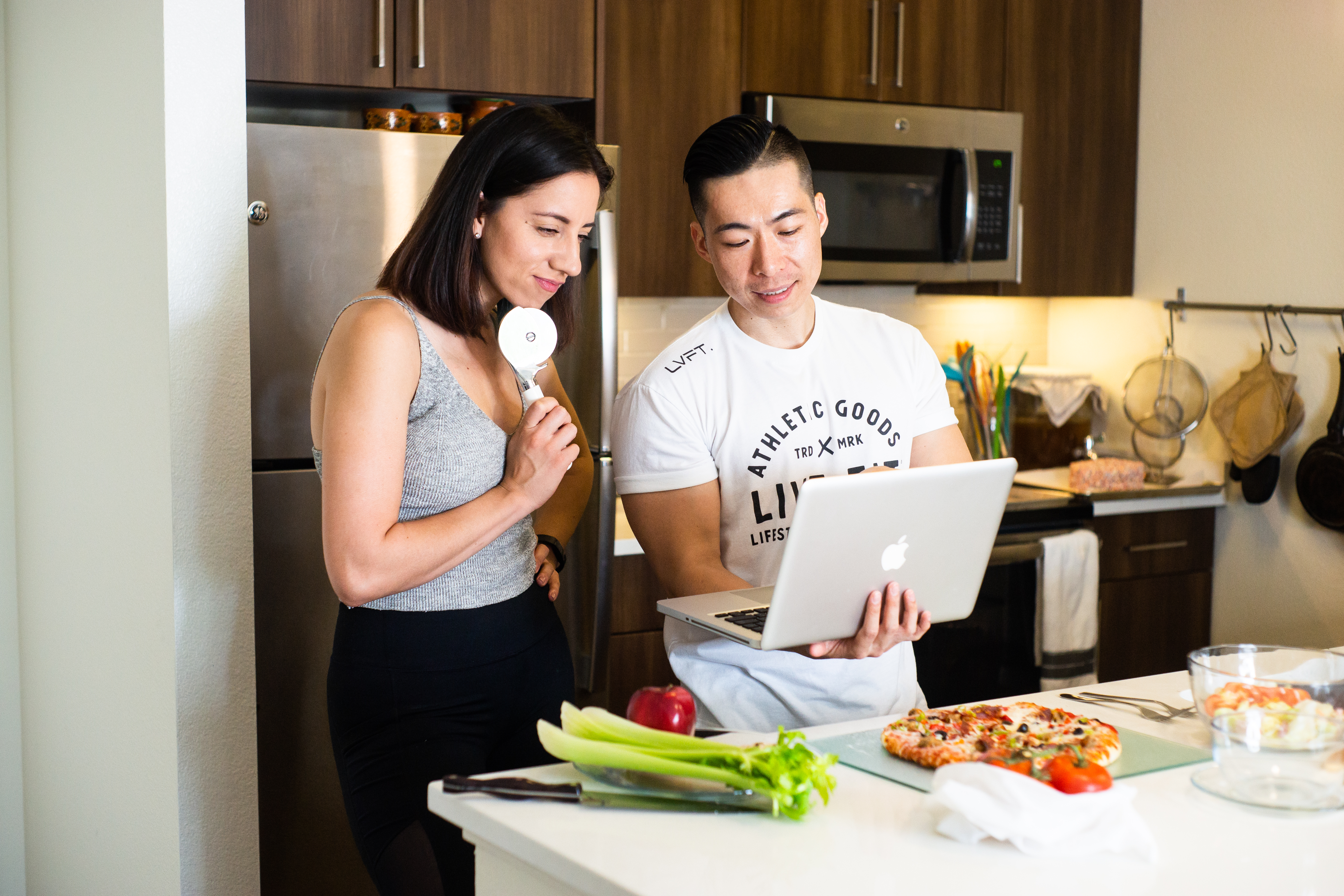 Image of two people preparing a meal